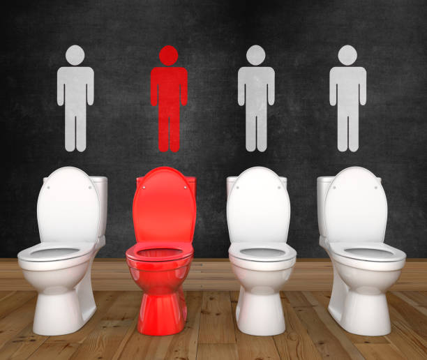 Три белых и один красный унитаза в ряд на фоне темной стены с символикой мужского туалета над каждым.